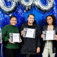 five students pose with certificates